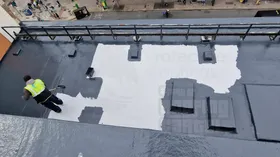 Applying protective topcoat over Lava waterproofing system