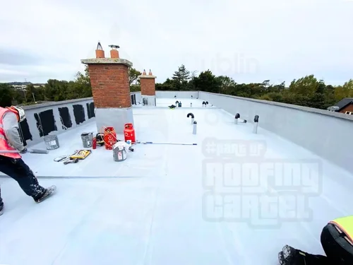 Liquid waterproofing application on apartment complex flat roof