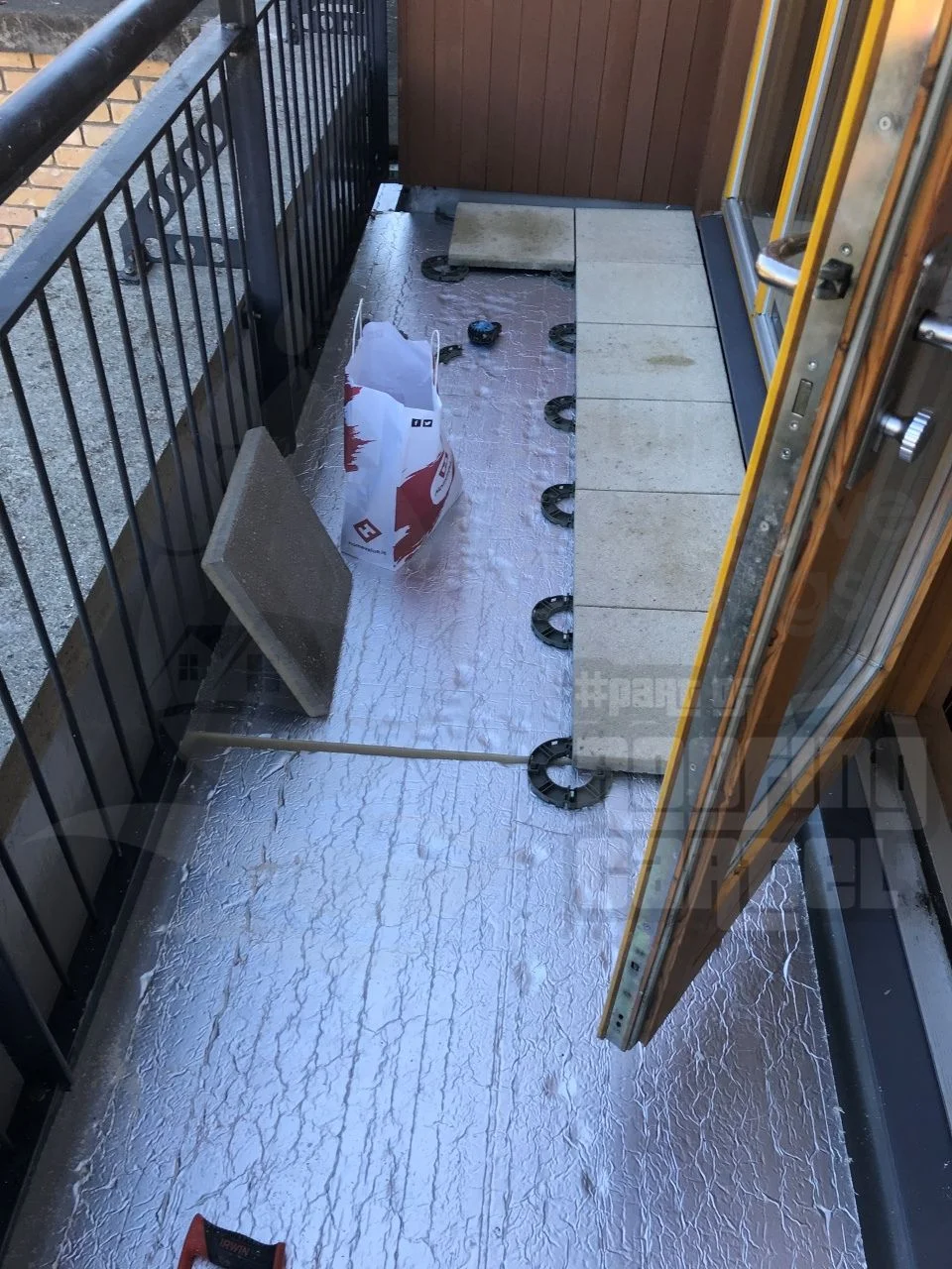 Balcony isolation and waterproofing membrane being applied by a professional