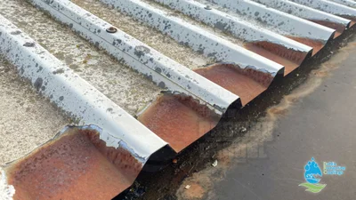 Cut-edge corrosion damage on metal roof requiring treatment