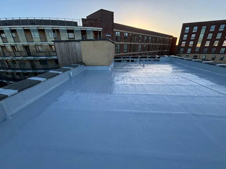 Completed flat roof waterproofing finish with professional coating applied